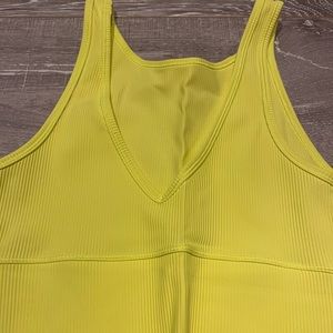 Neon yellow Lululemon sports bra
